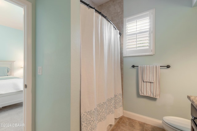 ensuite bathroom featuring toilet, vanity, tile patterned flooring, ensuite bath, and baseboards