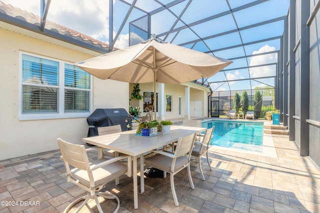 outdoor pool with glass enclosure, outdoor dining space, area for grilling, and a patio area
