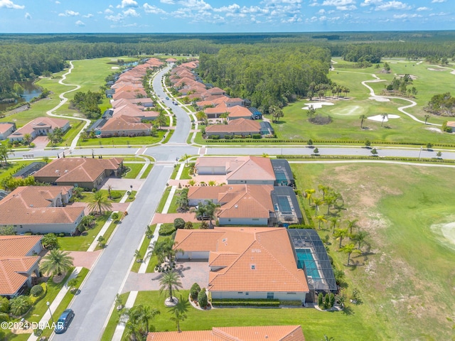 drone / aerial view with a water view, a residential view, and golf course view