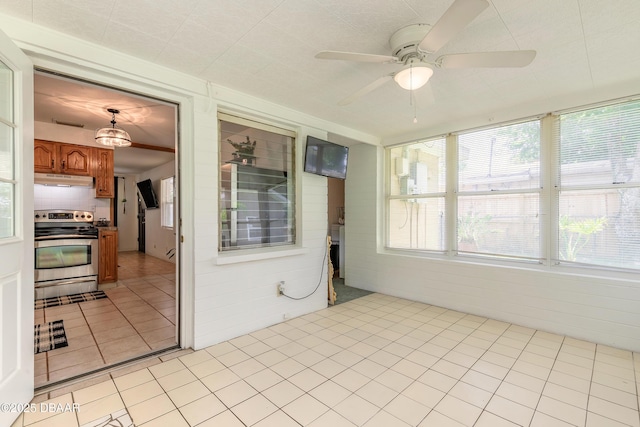125 Azalea Dr, Daytona Beach, FL 32117 - unfurnished sunroom featuring tile patterned flooring