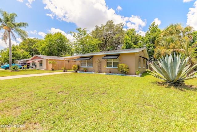 125 Azalea Dr, Daytona Beach, FL 32117 - single story home with a front lawn, driveway, and an attached carport