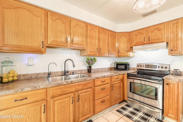 125 Azalea Dr, Daytona Beach, FL 32117 - kitchen featuring under cabinet range hood, stainless steel range with electric stovetop, backsplash, light countertops, and black microwave