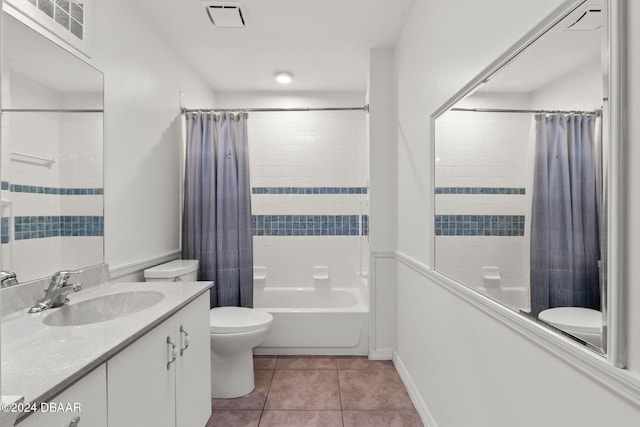 full bathroom featuring tile patterned flooring, vanity, toilet, and shower / tub combo