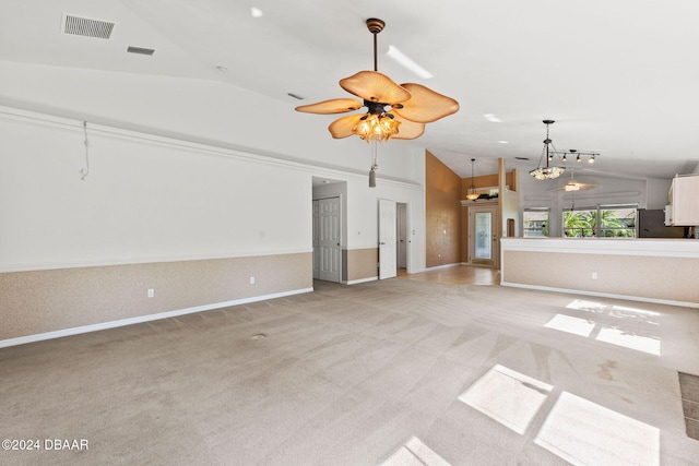 unfurnished living room with vaulted ceiling, light colored carpet, and ceiling fan