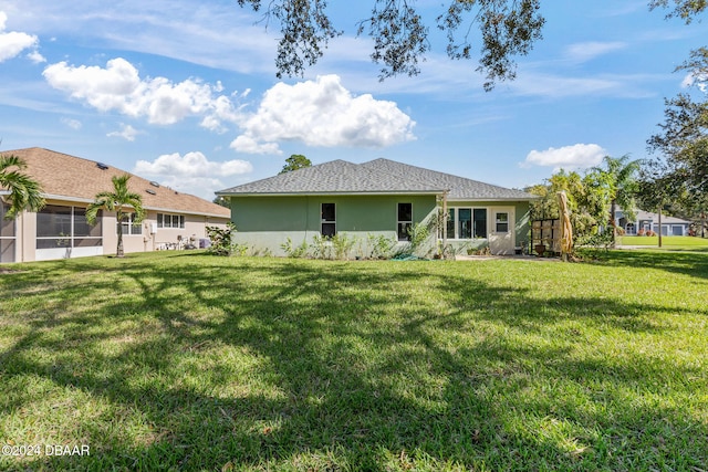 back of house with a yard