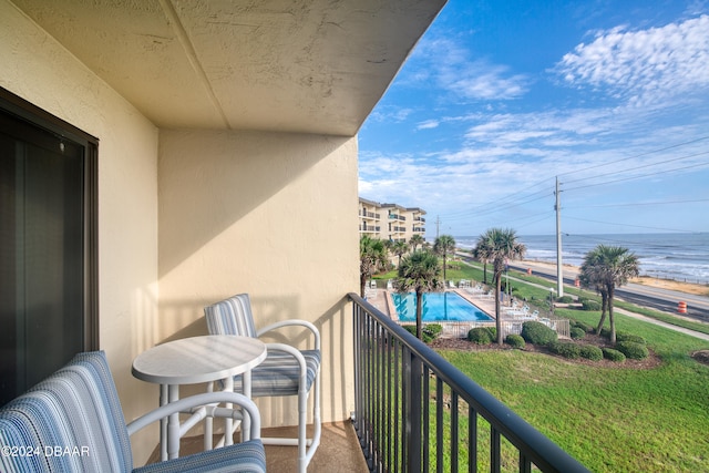 balcony featuring a water view