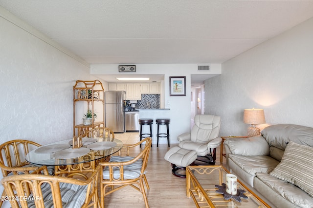 living room with light hardwood / wood-style flooring