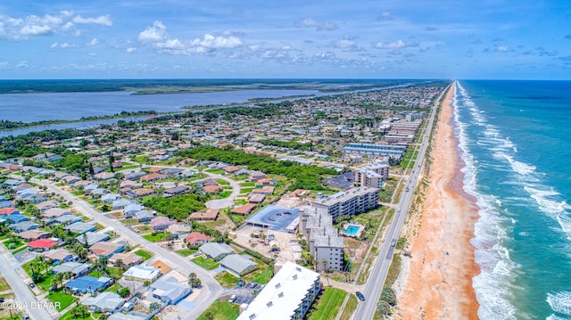 aerial view featuring a view of the beach and a water view