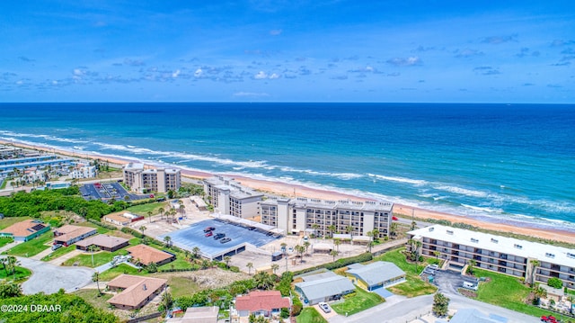 bird's eye view with a view of the beach and a water view