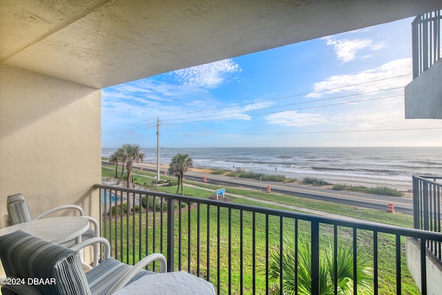 balcony featuring a water view