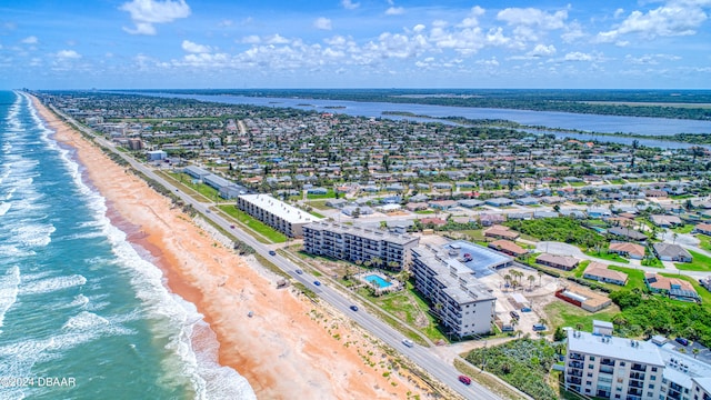 bird's eye view featuring a water view and a view of the beach