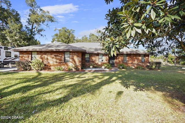 ranch-style house with a front lawn