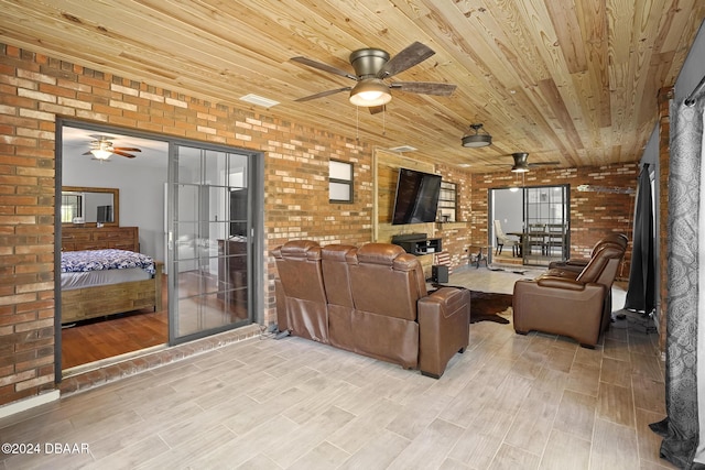 living room featuring wooden ceiling, brick wall, and light hardwood / wood-style flooring