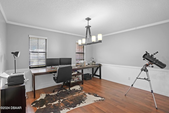 home office with a notable chandelier, crown molding, wood-type flooring, and a textured ceiling