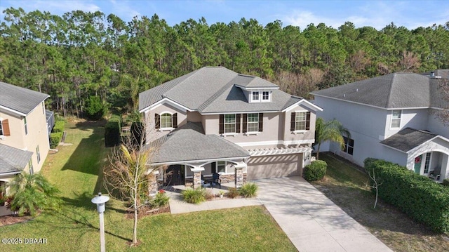 view of front facade featuring a garage and a front lawn