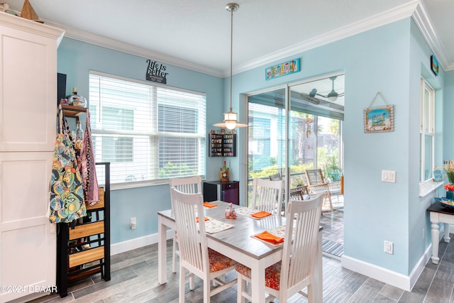 dining room featuring ornamental molding and hardwood / wood-style flooring