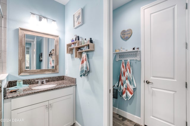 bathroom with vanity and hardwood / wood-style floors