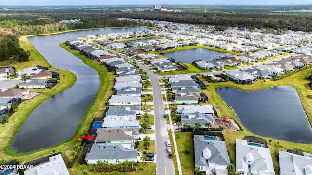 drone / aerial view with a water view