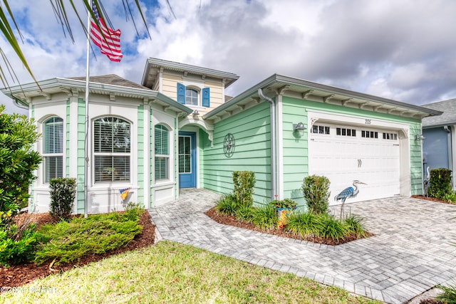 view of front of property with a garage