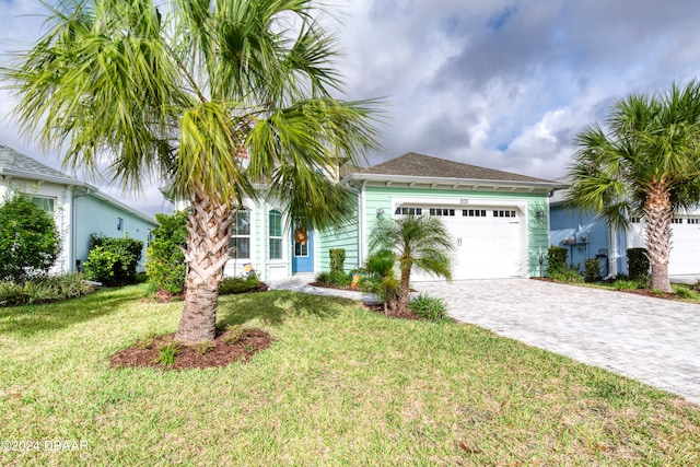 view of front facade featuring a garage and a front yard