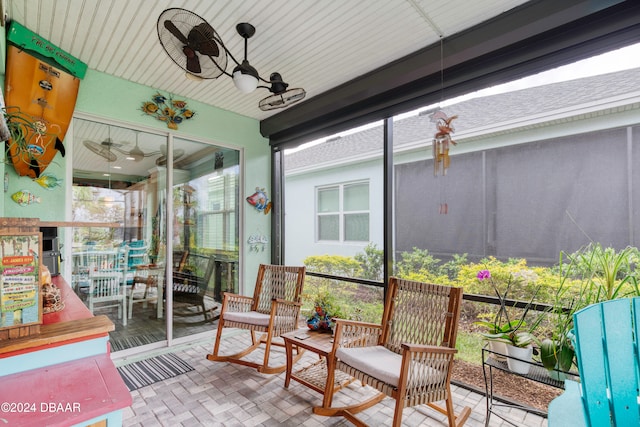 sunroom with plenty of natural light and ceiling fan