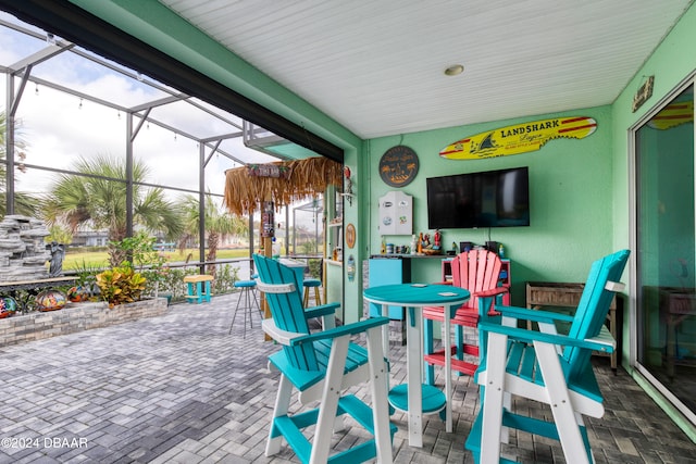 view of patio with a lanai