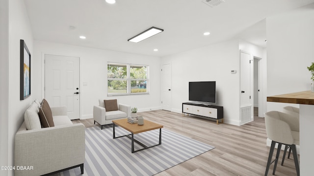 living room with light hardwood / wood-style floors