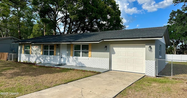 1801 James St, South Daytona, FL 32119 - single story home featuring an attached garage, concrete driveway, a shingled roof, and concrete block siding