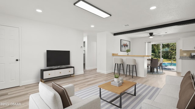 1801 James St, South Daytona, FL 32119 - living room with light wood-type flooring, recessed lighting, baseboards, a ceiling fan, and beamed ceiling
