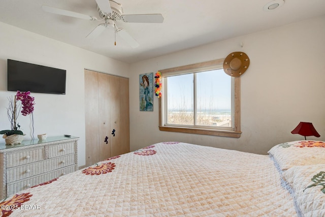 bedroom featuring a ceiling fan and a closet