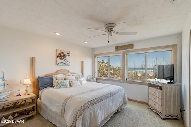 bedroom featuring recessed lighting, light colored carpet, ceiling fan, and baseboards