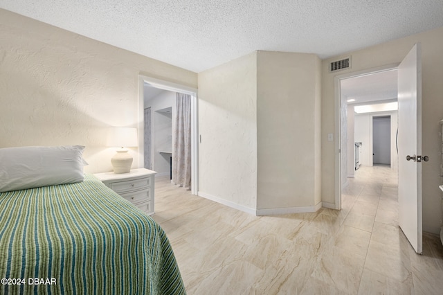 bedroom with a textured ceiling