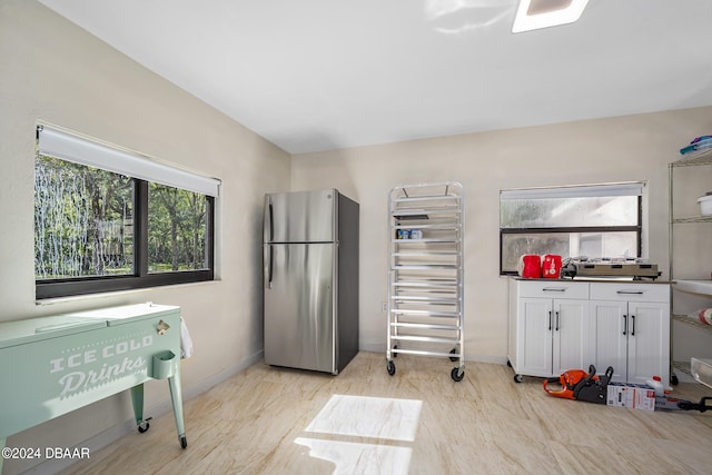 miscellaneous room with a healthy amount of sunlight and radiator