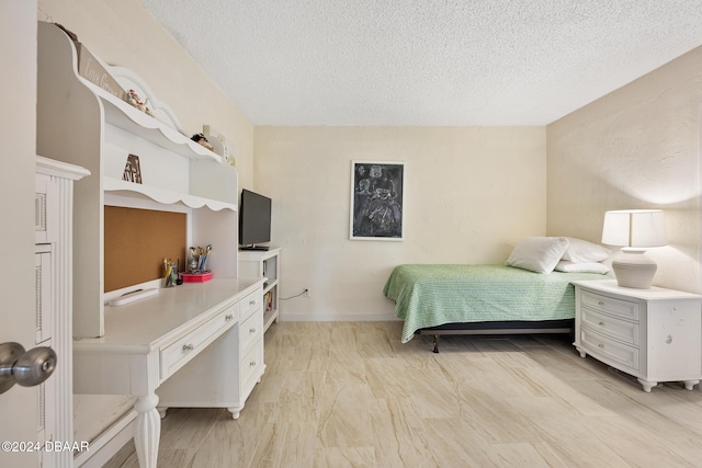 bedroom featuring a textured ceiling