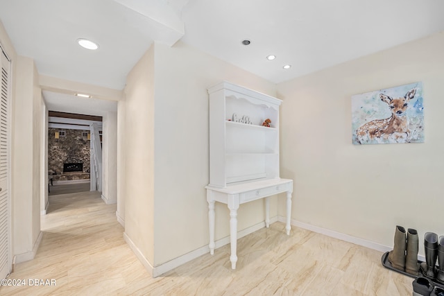 hallway with light hardwood / wood-style flooring