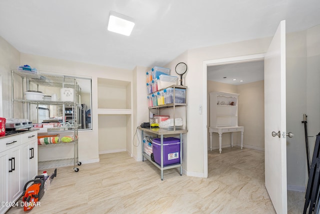 kitchen featuring white cabinetry