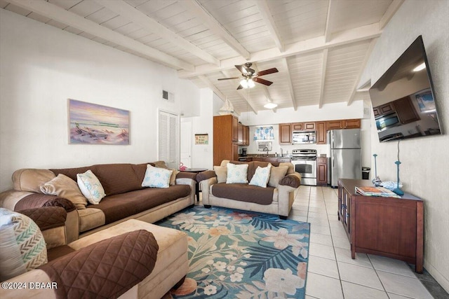 living room featuring vaulted ceiling with beams, ceiling fan, wooden ceiling, and light tile patterned flooring