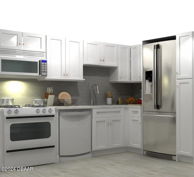 kitchen with appliances with stainless steel finishes and white cabinetry