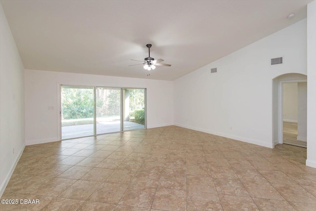 spare room featuring light tile patterned floors, ceiling fan, and lofted ceiling