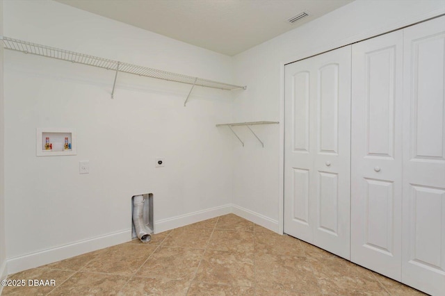 laundry room featuring electric dryer hookup, hookup for a washing machine, and light tile patterned floors