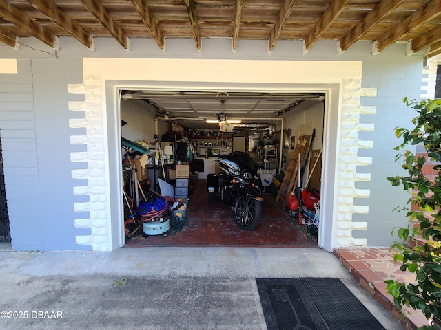 garage featuring concrete driveway