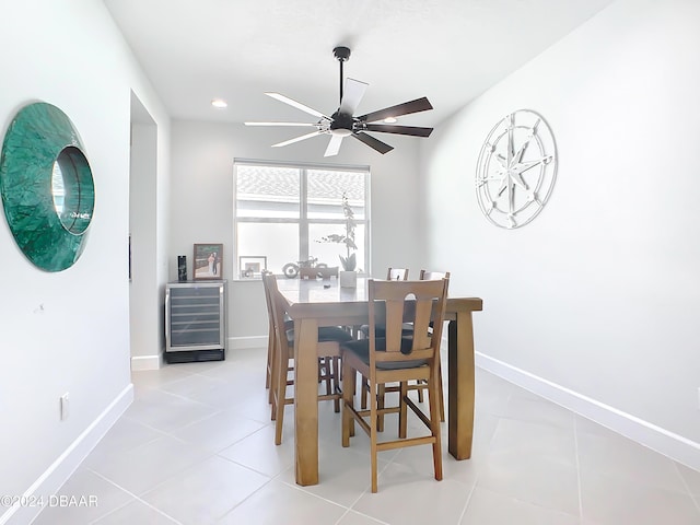 dining area with wine cooler, ceiling fan, and light tile patterned flooring