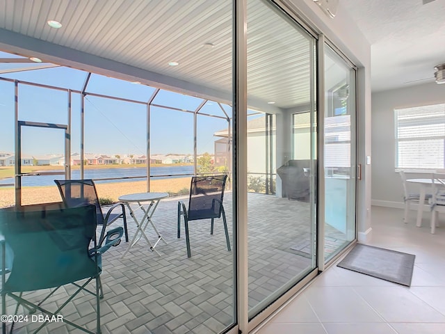 view of patio featuring glass enclosure