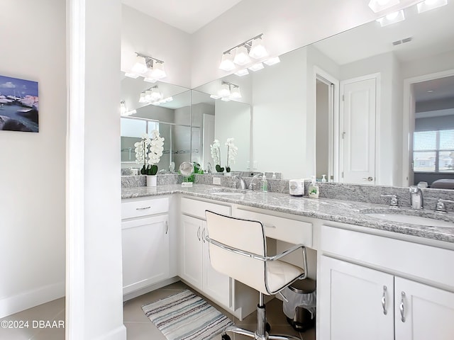 bathroom with tile patterned flooring and vanity