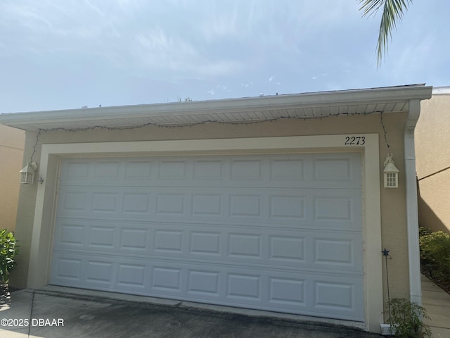 2273 Hawks Cove Cir, New Smyrna Beach, FL 32168 - garage featuring concrete driveway