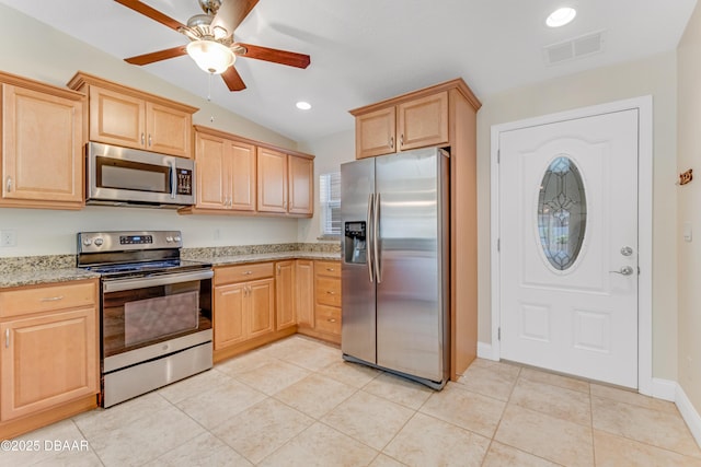 kitchen with light tile patterned floors, light stone countertops, visible vents, light brown cabinetry, and appliances with stainless steel finishes