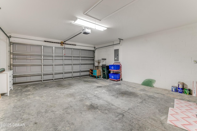 garage featuring electric panel and a garage door opener