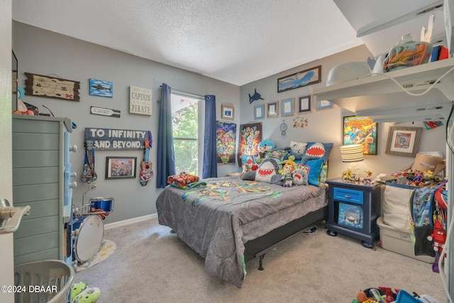 carpeted bedroom featuring a textured ceiling