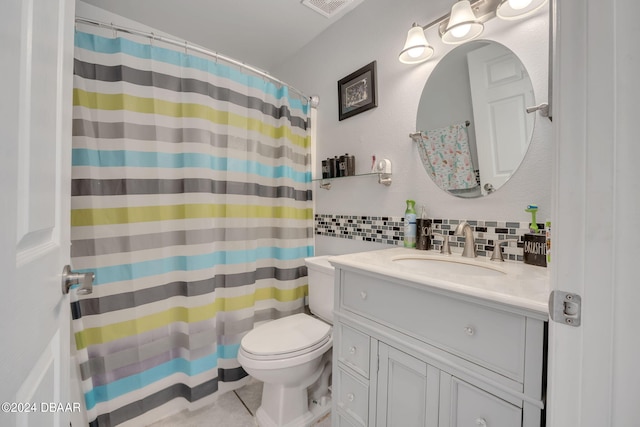 bathroom featuring tasteful backsplash, tile patterned floors, a shower with curtain, vanity, and toilet