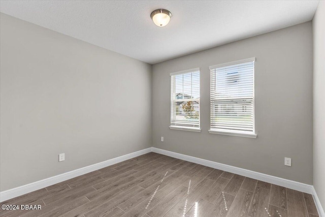 empty room featuring hardwood / wood-style floors